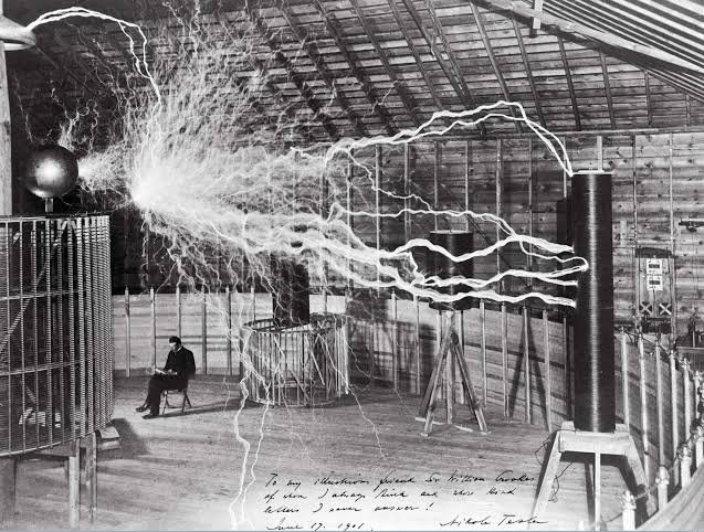 Nikola Tesla in his Colorado Springs laboratory, 1899, surrounded by lightning from his magnifying transmitter